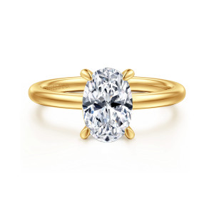Gabriel & Co. ER15972O6Y84JJ 18 karat yellow gold Classic engagement ring, front view of an oval center held by slender prongs on a smooth round band