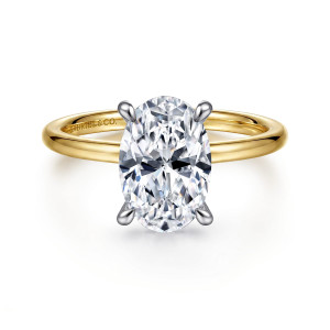 Gabriel & Co. ER15972O8M44JJ 14 karat white and yellow gold Classic engagement ring, front view of an oval center in four claw prongs above a smooth band in the warmer tone