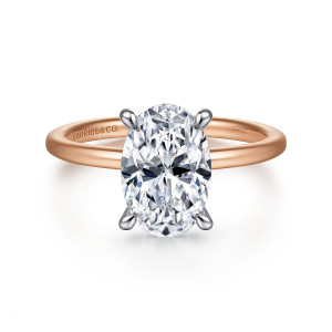 Gabriel & Co. ER15972O8T44JJ 14 karat white and rose gold Classic engagement ring, front view of an oval center with a cooler head above a smooth band in the warmer tone