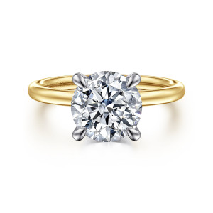Gabriel & Co. ER15972R10M44JJ 14 karat white and yellow gold Classic engagement ring, front view of a round center gripped by four slender prongs above a plain smooth band