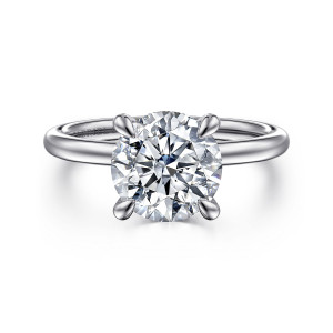 Gabriel & Co. ER15972R10W44JJ 14 karat white gold Classic engagement ring, front view of a round center in four tapered prongs on a plain rounded band