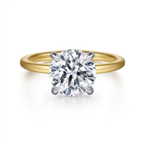 Gabriel & Co. ER15972R12M44JJ 14 karat white and yellow gold Classic engagement ring, front view of a round center held by four slender claw prongs on a smooth plain band