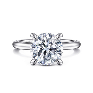 Gabriel & Co. ER15972R12W44JJ 14 karat white gold Classic engagement ring, front view of a large round center on prongs with teardrop tips above a smooth plain band
