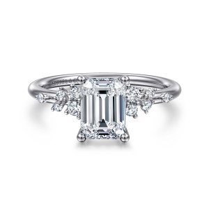 Gabriel & Co. ER15973E6PT4JJ platinum Starlight engagement ring, front view of an emerald cut center flanked by scattered clusters of small round stones
