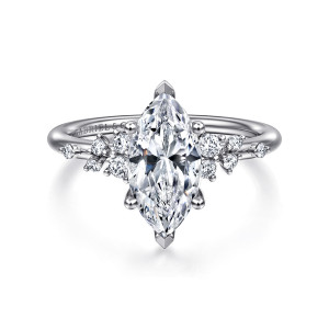 Gabriel & Co. ER15973M6W44JJ 14 karat white gold Starlight engagement ring, front view of a marquise center with pointed tip prongs and scattered small diamonds on both shoulders