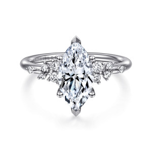 Gabriel & Co. ER15973M6W84JJ 18 karat white gold Starlight engagement ring, front view of a marquise center with pointed tip prongs and scattered small stones on both shoulders