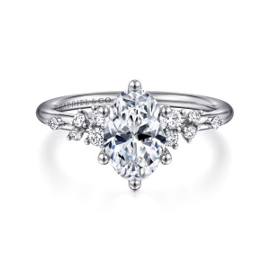 Gabriel & Co. ER15973O6PT4JJ platinum Starlight engagement ring, front view of an oval center held by six ball tipped prongs among scattered small stones