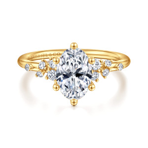 Gabriel & Co. ER15973O6Y84JJ 18 karat yellow gold Starlight engagement ring, front view of an upright oval center with ball tipped prongs and diamonds fanning out to each side