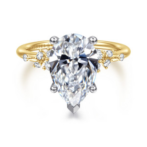 Gabriel & Co. ER15973P12M44JJ 14 karat white and yellow gold Starlight engagement ring, front view of a pear shaped center with its point toward the viewer between loose diamond clusters