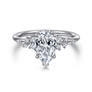 Gabriel & Co. ER15973P6W44JJ 14 karat white gold Starlight engagement ring, front view of a pear shaped center with scattered small diamonds on each shoulder