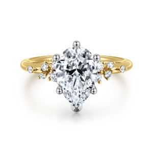 Gabriel & Co. ER15973P8M44JJ 14 karat white and yellow gold Starlight engagement ring, front view of a pear shaped center with clusters of small round diamonds at each shoulder