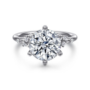 Gabriel & Co. ER15973R12W44JJ 14 karat white gold Starlight engagement ring, front view of a round center gripped by ball tipped prongs with small stone clusters on each side