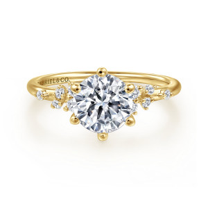 Gabriel & Co. ER15973R6Y44JJ 14 karat yellow gold Starlight engagement ring, front view of a round center on six ball tipped prongs beside groups of tiny round diamonds