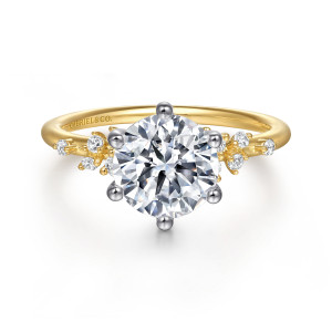 Gabriel & Co. ER15973R8M44JJ 14 karat white and yellow gold Starlight engagement ring, front view of a round center in six ball tipped prongs with diamond bunches on both shoulders