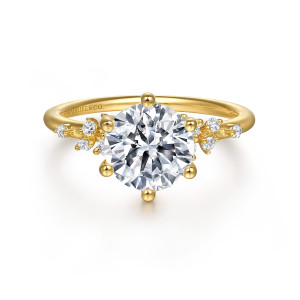 Gabriel & Co. ER15973R8Y44JJ 14 karat yellow gold Starlight engagement ring, front view of a round center with ball tipped prongs and small stones clustered on both shoulders