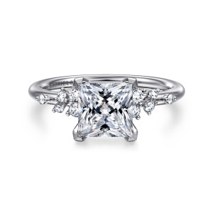 Gabriel & Co. ER15973S6W44JJ 14 karat white gold Starlight engagement ring, front view of a princess cut center held at its corners, with small stones grouped on both shoulders