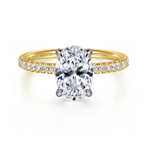 Gabriel & Co. ER16058O8M44JJ 14 karat white and yellow gold Classic engagement ring, front view of an oval center with rounded prong tips and small stones on the band