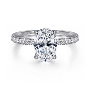 Gabriel & Co. ER16058O8W44JJ 14 karat white gold Classic engagement ring, front view of an oval center with pointed claw prongs and diamonds along both shoulders