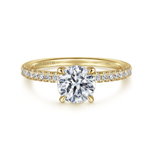 Gabriel & Co. ER16058R4Y44JJ 14 karat yellow gold Classic engagement ring, front view of a round center in slender prongs above a band of round diamonds