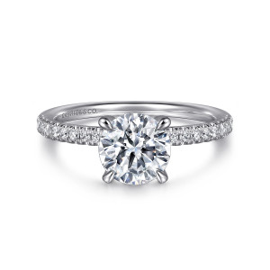 Gabriel & Co. ER16058R6W44JJ 14 karat white gold Classic engagement ring, front view of a round center on tapered claw prongs with diamonds lining both shoulders