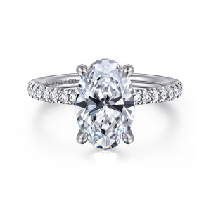 Gabriel & Co. ER16059O10W44JJ 14 karat white gold Classic engagement ring, front view of an oval center on four slim prongs with pave stones along the shoulders