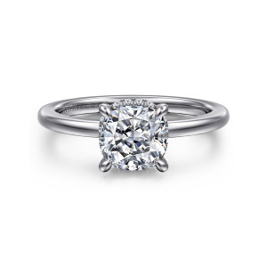 Gabriel & Co. ER16061C6PT4JJ platinum Classic engagement ring, front view of a cushion cut center in four claws with small diamonds glinting at its edges