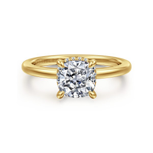 Gabriel & Co. ER16061C6Y44JJ 14 karat yellow gold Classic engagement ring, front view of a cushion cut center in four rounded prongs with a hint of diamonds behind it