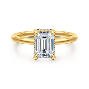 Gabriel & Co. ER16061E6Y84JJ 18 karat yellow gold Classic engagement ring, front view of an emerald cut center with tiny diamonds just showing along its edges