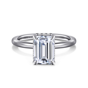 Gabriel & Co. ER16061E8W44JJ 14 karat white gold Classic engagement ring, front view of an emerald cut center on slim corner prongs with a dotted edge of stones below