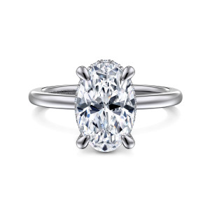 Gabriel & Co. ER16061O10W44JJ 14 karat white gold Classic engagement ring, front view of an oval center on rounded claws with a thin beaded edge below it