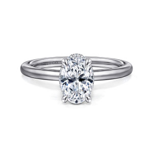 Gabriel & Co. ER16061O4W44JJ 14 karat white gold Classic engagement ring, front view of an oval center with four slim claws and a fine beaded edge of the halo