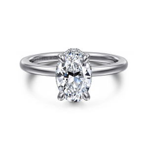 Gabriel & Co. ER16061O6W84JJ 18 karat white gold Classic engagement ring, front view of an oval center on rounded prongs with a faint line of small diamonds beneath