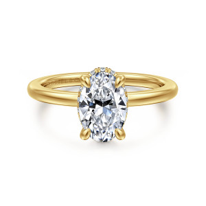 Gabriel & Co. ER16061O6Y44JJ 14 karat yellow gold Classic engagement ring, front view of an oval center with small prongs and only a glint of diamonds at its base