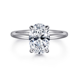 Gabriel & Co. ER16061O8W44JJ 14 karat white gold Classic engagement ring, front view of an oval center with four slender prongs and no visible stones on the band
