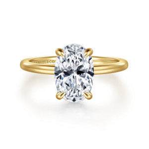 Gabriel & Co. ER16061O8Y44JJ 14 karat yellow gold Classic engagement ring, front view of the oval center in slender prongs with nothing showing beneath it