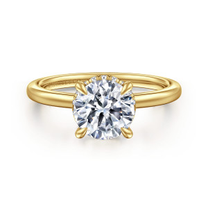 Gabriel & Co. ER16061R6Y44JJ 14 karat yellow gold Classic engagement ring, front view of a round center in four tapered prongs with tiny diamonds at its edge