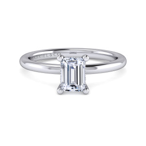 Gabriel & Co. ER16117E4W44JJ 14 karat white gold Classic engagement ring, front view of an emerald cut center held by prongs with rounded ball tips on a slim band