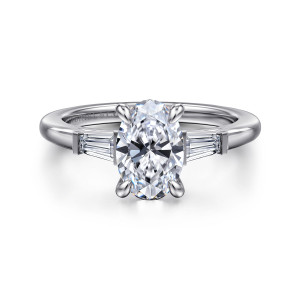 Gabriel & Co. ER16121O6W43JJ 14 karat white gold Classic engagement ring, front view of an oval center with a tapered baguette in a bar setting on each side
