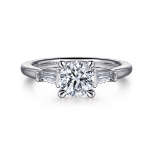 Gabriel & Co. ER16121R4W43JJ 14 karat white gold Classic engagement ring, front view of a round center between two tapered step cut stones held by small bars