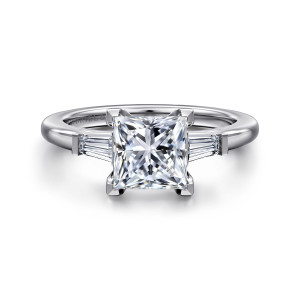 Gabriel & Co. ER16121S6W43JJ 14 karat white gold Classic engagement ring, front view of a princess cut center with angular corner prongs between two tapered baguette diamonds