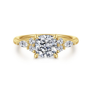 Gabriel & Co. ER16125C6Y44JJ 14 karat yellow gold Contemporary engagement ring, front view of a cushion cut center between clusters of round and elongated diamonds