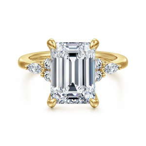Gabriel & Co. ER16125E17Y44JJ 14 karat yellow gold Contemporary engagement ring, front view of an emerald cut center with bold corner prongs and a diamond cluster on each side