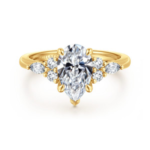 Gabriel & Co. ER16125P6Y84JJ 18 karat yellow gold Contemporary engagement ring, front view of a pear shaped center with a pointed V tip and diamond clusters on both sides
