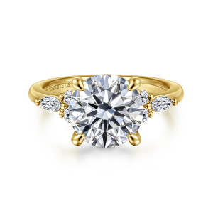 Gabriel & Co. ER16125R12Y44JJ 14 karat yellow gold Contemporary engagement ring, front view of a round center gripped by tapered prongs beside a diamond cluster on each side