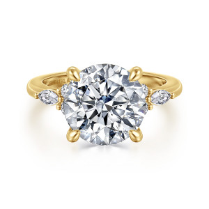 Gabriel & Co. ER16125R16Y44JJ 14 karat yellow gold Contemporary engagement ring, front view of a round center with four teardrop tipped prongs and a small cluster on each shoulder