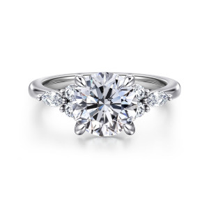 Gabriel & Co. ER16125R8PT4JJ platinum Contemporary engagement ring, front view of a round center in teardrop tipped prongs with stone groups on the shoulders