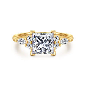 Gabriel & Co. ER16125S6Y84JJ 18 karat yellow gold Contemporary engagement ring, front view of a princess cut center with angular corner prongs and beaded shoulder clusters