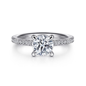 Gabriel & Co. ER16128R4PT4JJ platinum Classic engagement ring, front view of a round center in four teardrop tipped prongs above a fine diamond line