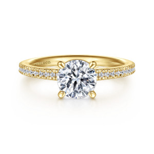 Gabriel & Co. ER16128R4Y44JJ 14 karat yellow gold Classic engagement ring, front view of a round center on claw prongs above fine round stones set along the shoulders