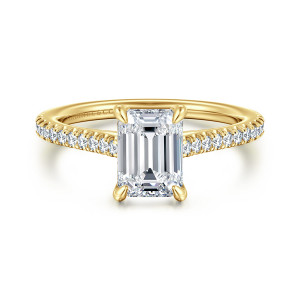 Gabriel & Co. ER16129E6Y44JJ 14 karat yellow gold Contemporary engagement ring, front view of an emerald cut center with claw prongs at the corners and stones on the shoulders
